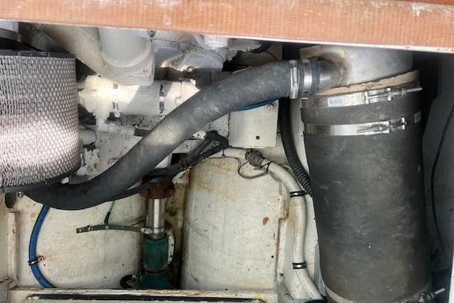 Slide: The Image of Engine compartment of a 2007 Northern Bay Hardtop Cruiser/Fishing Vessel, showing hoses and components. - 27