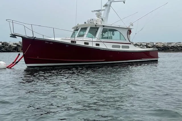 Slide: The Image of 2007 Northern Bay Hardtop Cruiser/Fishing Vessel on calm water near rocky shoreline. - 31