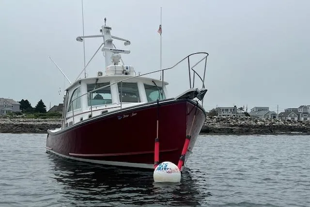 Slide: The Image of 2007 Northern Bay Hardtop Cruiser/Fishing Vessel anchored near rocky shoreline. - 32