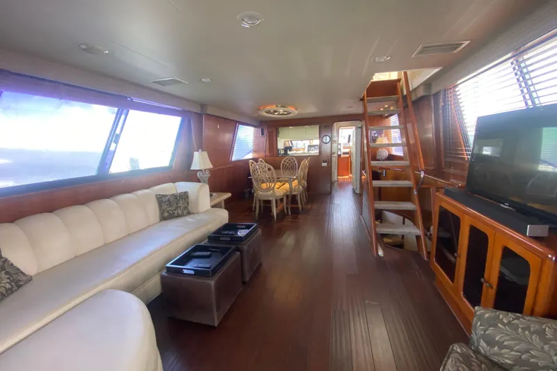 Slide: The Image of Luxurious interior of a 1990 Viking 63 Motor Yacht with elegant furnishings and wood accents. - 11