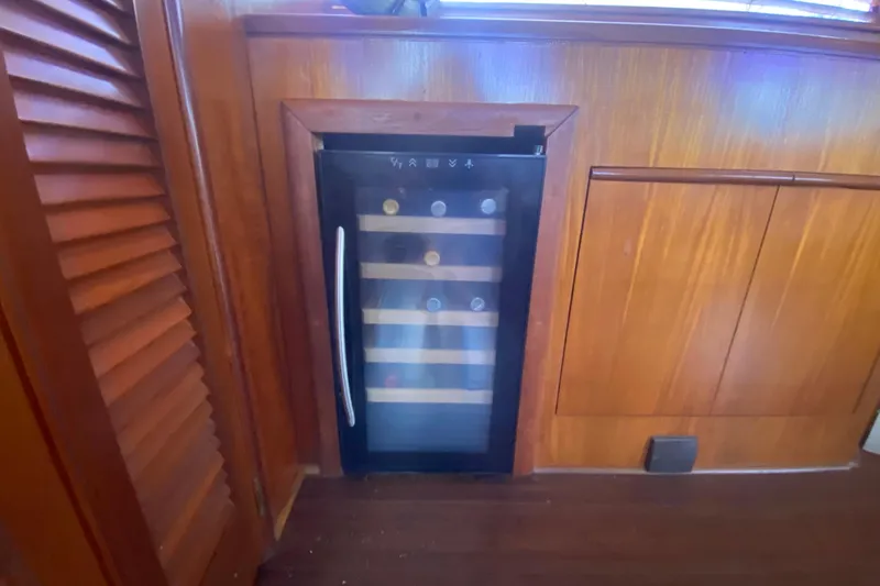 Slide: The Image of Wine cooler in wooden interior of 1990 Viking 63 Motor Yacht. - 20