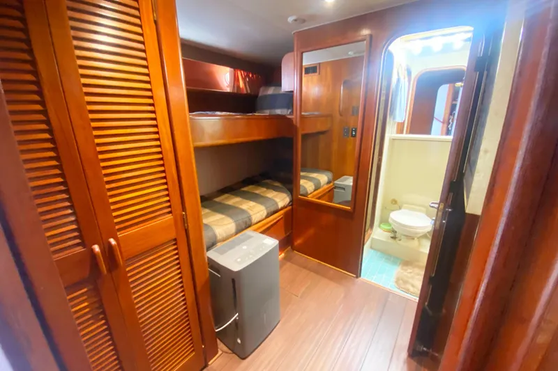 Slide: The Image of Interior of 1990 Viking 63 Motor Yacht with bunk beds and bathroom. - 37