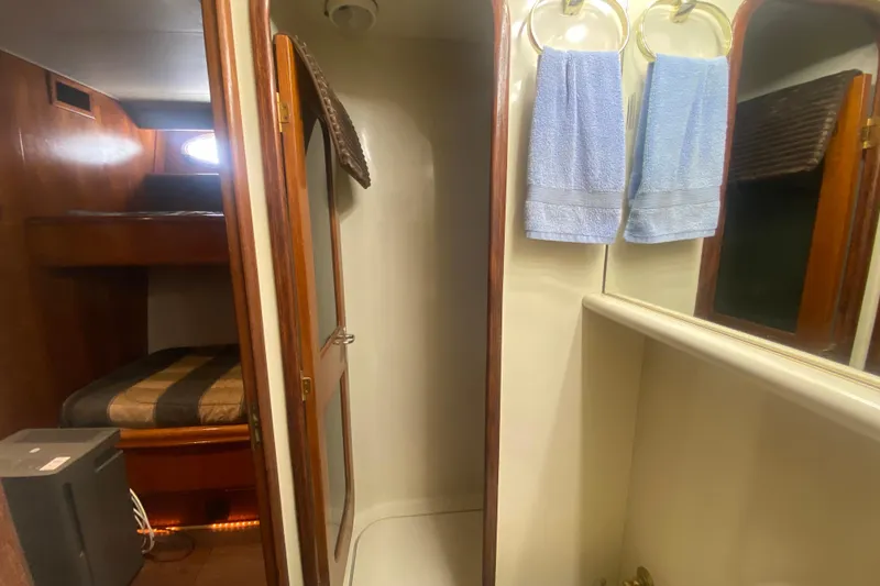 Slide: The Image of Interior of 1990 Viking 63 Motor Yacht with bunk beds and bathroom. - 39