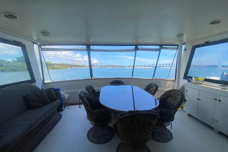 Slide: The Image of Interior of 1990 Viking 63 Motor Yacht with panoramic water views. - 4