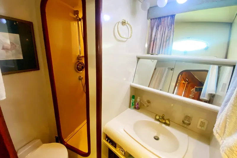 Slide: The Image of Bathroom interior of 1990 Viking 63 Motor Yacht with shower and vanity. - 44