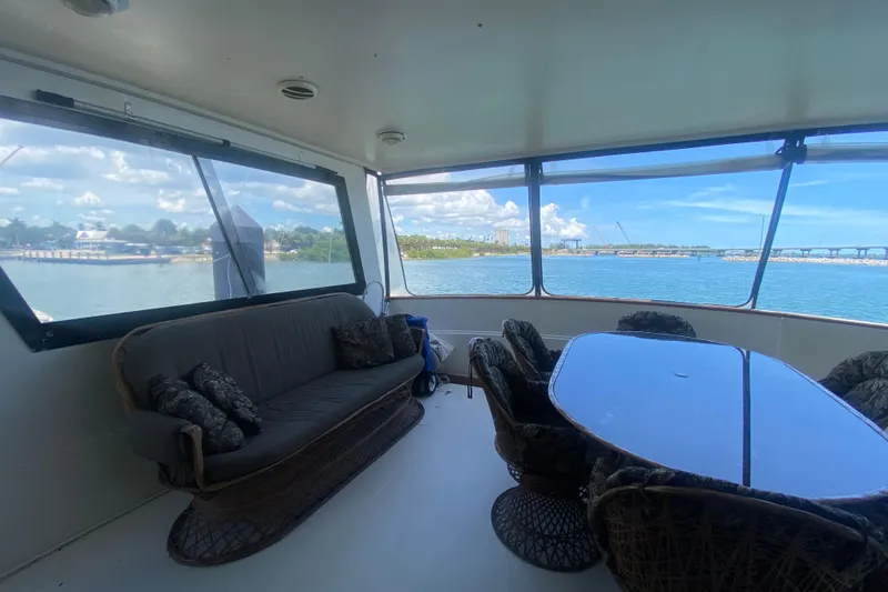 Slide: The Image of Interior of 1990 Viking 63 Motor Yacht with seating and ocean view. - 5