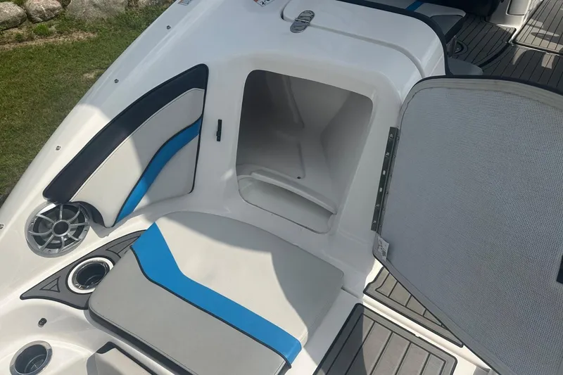 Slide: The Image of 2018 Yamaha 242 X boat interior with open storage compartment and stylish seating. - 13