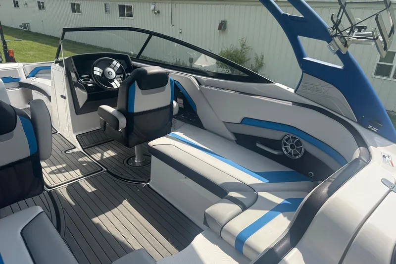 Slide: The Image of 2018 Yamaha 242 X boat interior with modern seating and steering wheel. - 14