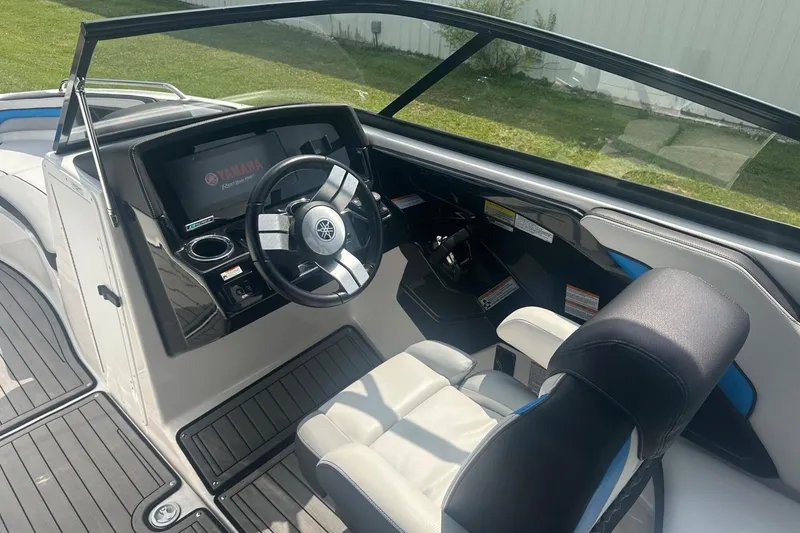 Slide: The Image of 2018 Yamaha 242 X boat interior with steering wheel and dashboard. - 18