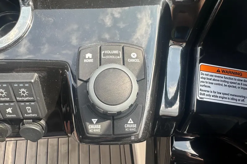 Slide: The Image of Control panel of a 2018 Yamaha 242 X boat with navigation and volume controls. - 31