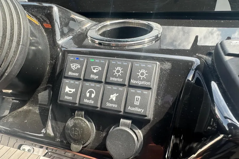 Slide: The Image of Control panel of a 2018 Yamaha 242 X boat with various function buttons. - 32