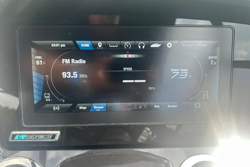 Slide: The Image of Dashboard of a 2018 Yamaha 242 X boat displaying FM radio and water temperature. - 33