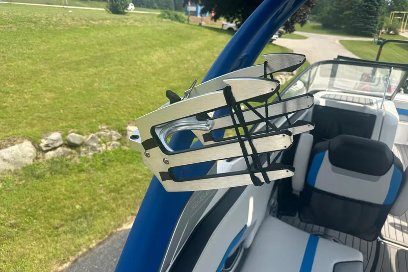 Slide: The Image of 2018 Yamaha 242 X boat with wakeboard rack and sleek interior design. - 40