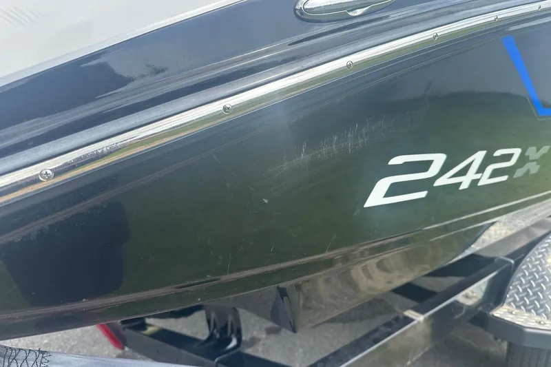 Slide: The Image of 2018 Yamaha 242 X boat side view with model number visible. - 41