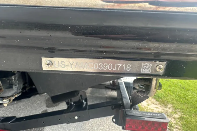 Slide: The Image of 2018 Yamaha 242 X boat with visible hull identification number on metal plate. - 43