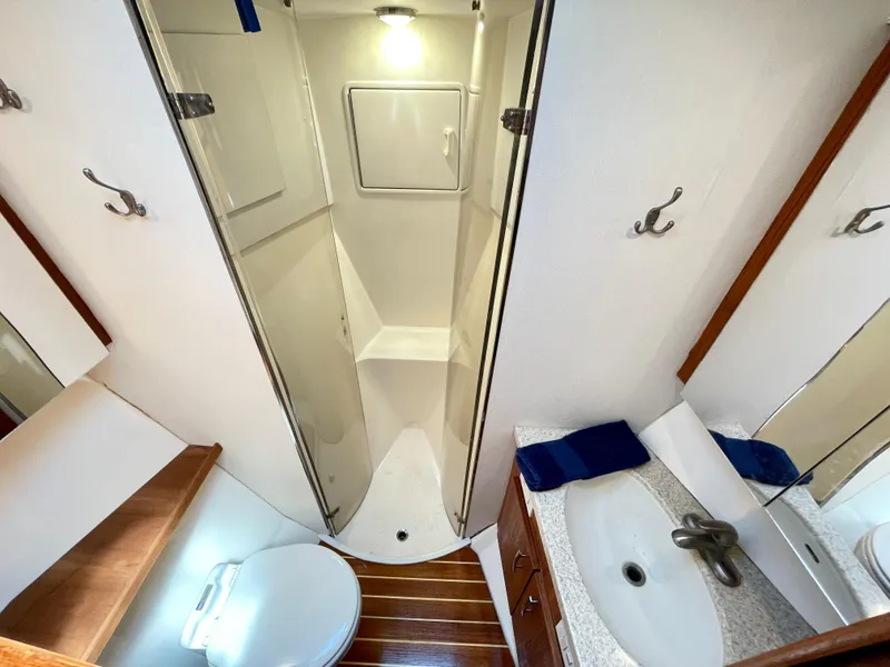 Slide: The Image of Bathroom interior of 2000 Ocean Yachts 43 Super Sport with shower and sink. - 13