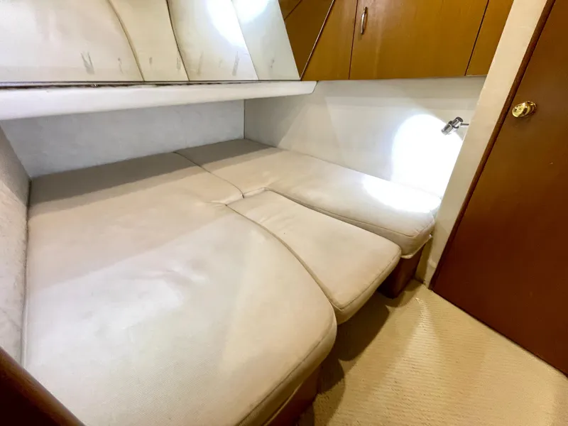 Slide: The Image of Interior cabin of 2000 Ocean Yachts 43 Super Sport with beige seating and wooden accents. - 15