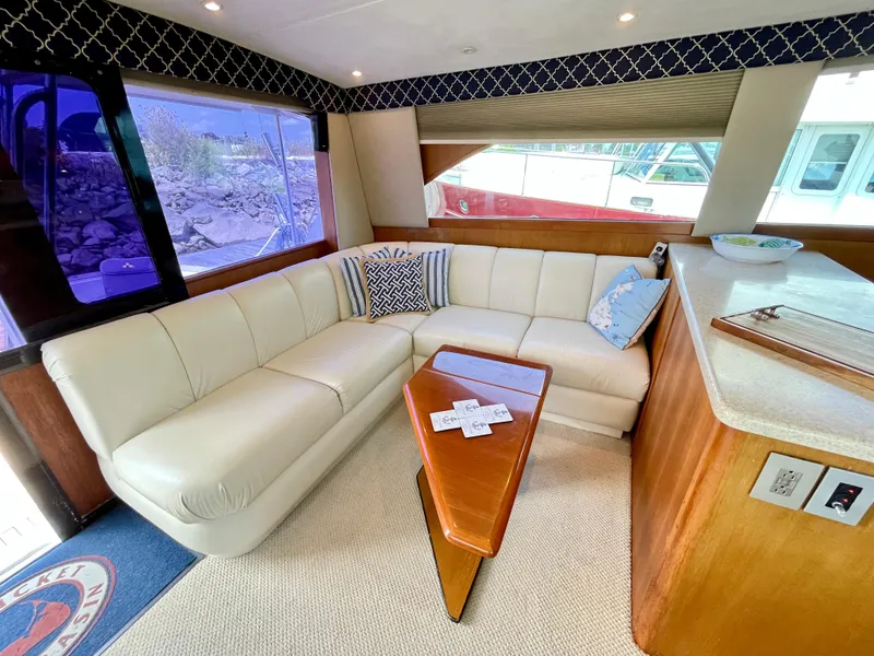 Slide: The Image of Luxurious interior of 2000 Ocean Yachts 43 Super Sport with plush seating and elegant decor. - 34