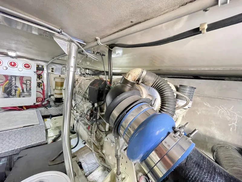 Slide: The Image of Engine room of 2000 Ocean Yachts 43 Super Sport, showcasing mechanical components and wiring. - 45