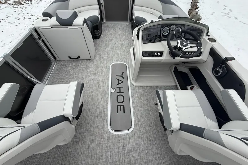 Slide: The Image of 2025 Tahoe 2185 boat interior with modern helm, seating, and sleek design. - 11