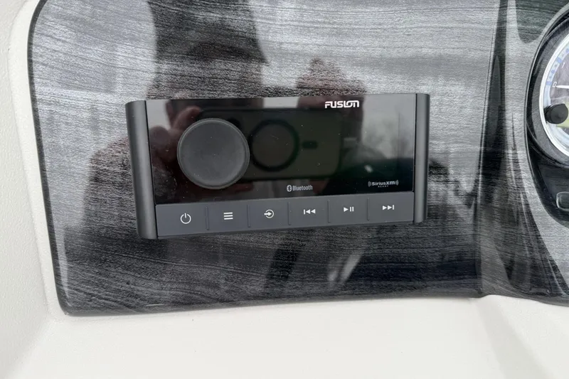 Slide: The Image of Control panel of a 2025 Tahoe 2185 with Fusion audio system and Bluetooth connectivity. - 14