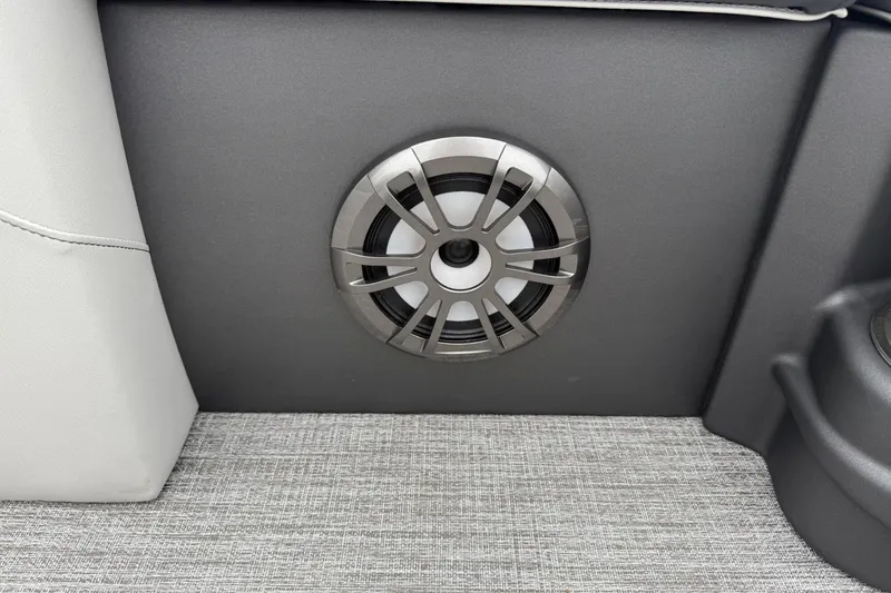 Slide: The Image of Speaker in 2025 Tahoe 2185 boat interior, featuring modern design and gray upholstery. - 18