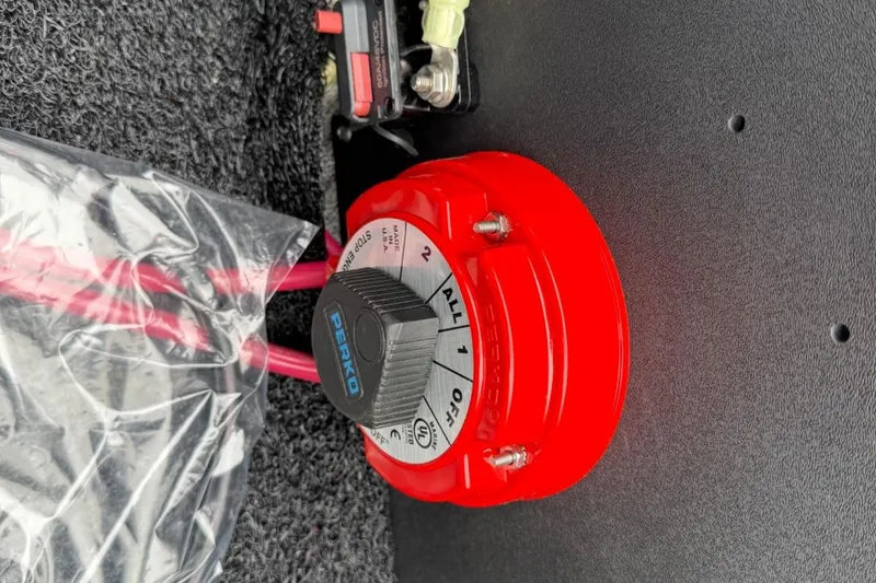 Slide: The Image of Red battery switch in a 2025 Tahoe 2185 boat, featuring Perko branding. - 19