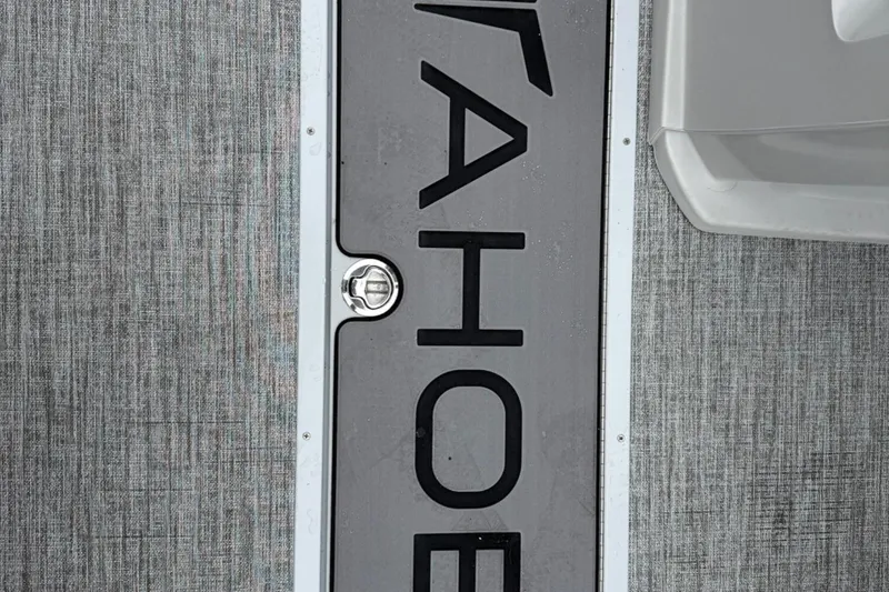Slide: The Image of 2025 Tahoe 2185 boat deck with textured surface and logo detail. - 20