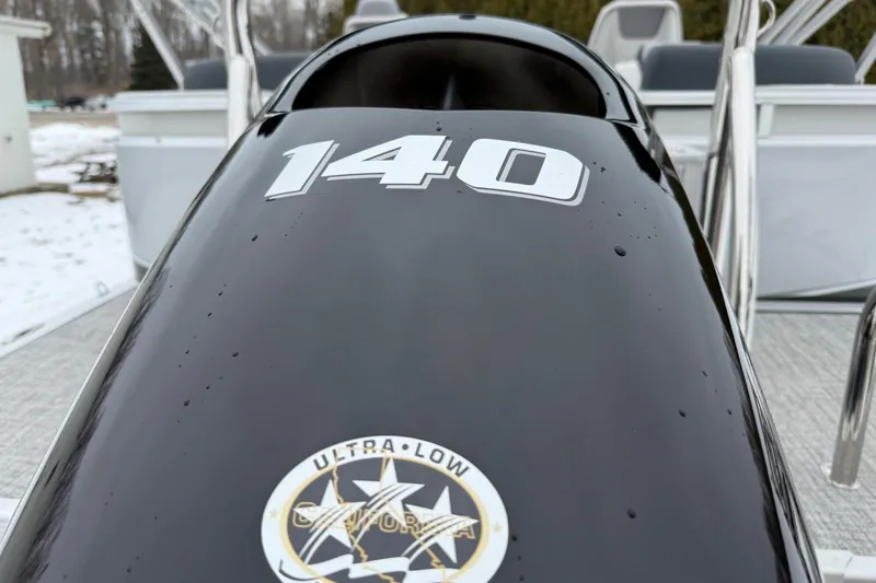 Slide: The Image of 2025 Tahoe 2185 boat engine with "140" marking and ultra-low emission badge. - 23