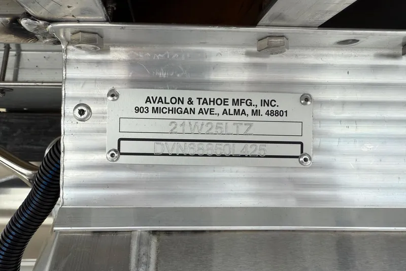 Slide: The Image of Metal plate with Avalon & Tahoe MFG details, model 21W25LTZ, serial DVN68850L425. - 24