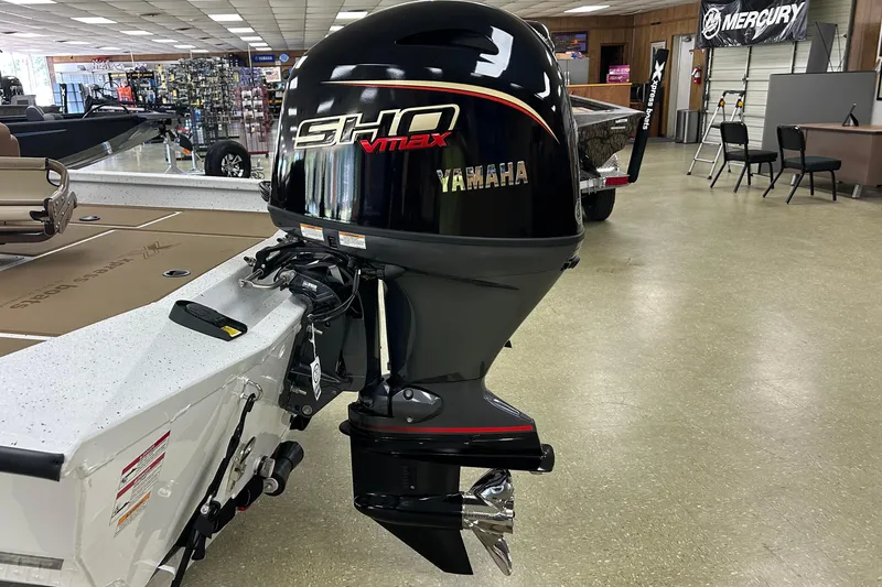 Slide: The Image of 2026 Xpress H18C Crappie boat with Yamaha SHO VMAX engine in showroom. - 5