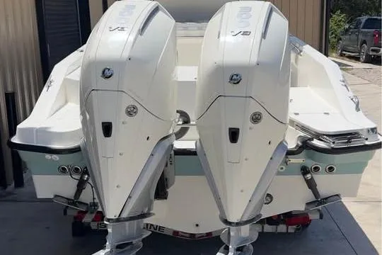 Slide: The Image of 2023 Boston Whaler 280 Vantage with dual outboard engines, rear view. - 12
