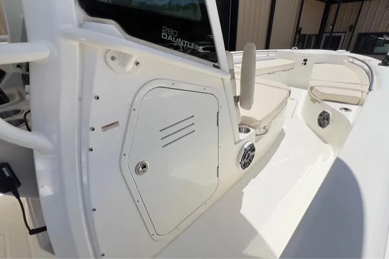 Slide: The Image of 2023 Boston Whaler 280 Vantage boat interior with seating and storage compartments. - 15