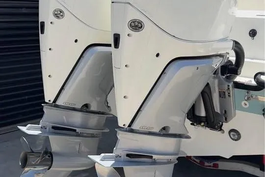 Slide: The Image of Twin outboard engines on a 2023 Boston Whaler 280 Vantage boat. - 16