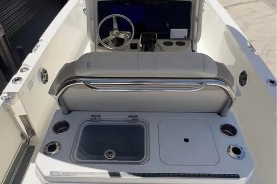Slide: The Image of 2023 Boston Whaler 280 Vantage boat interior with helm and seating area. - 18