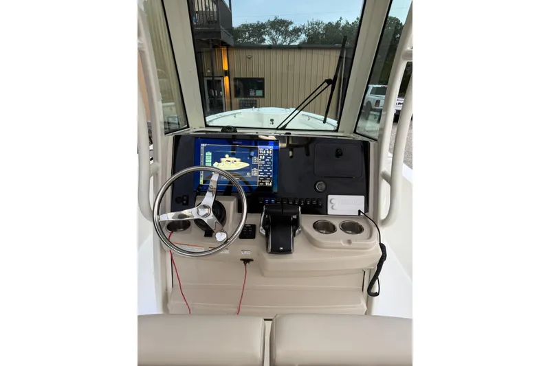 Slide: The Image of 2023 Boston Whaler 280 Dauntless helm with modern navigation display and controls. - 23