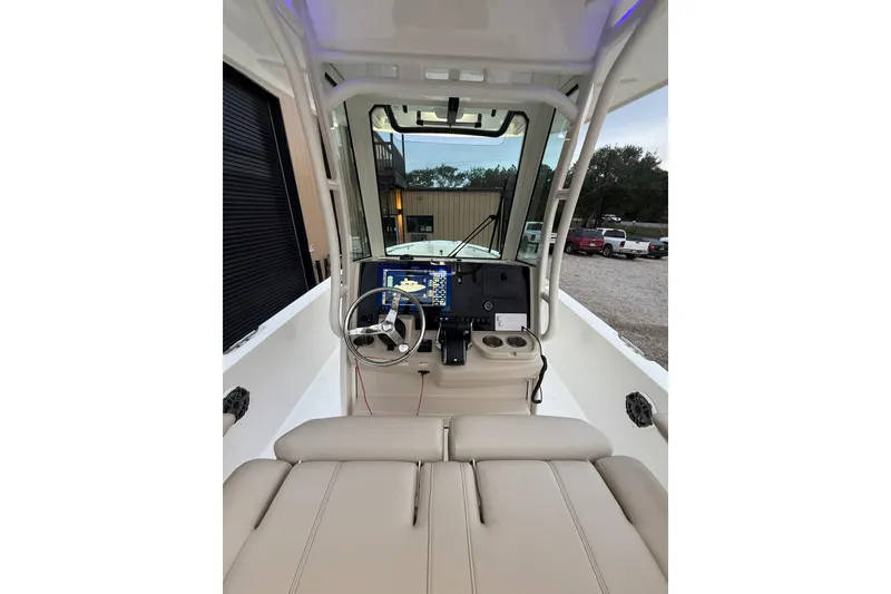 Slide: The Image of 2023 Boston Whaler 280 Dauntless helm with modern controls and comfortable seating. - 24