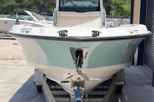 Slide: The Image of 2023 Boston Whaler 280 Vantage boat on trailer, front view in storage area. - 4