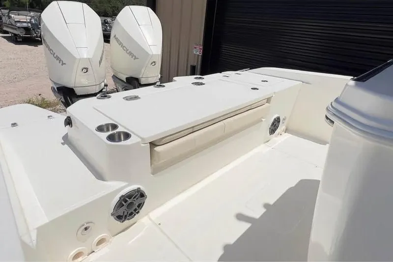 Slide: The Image of 2023 Boston Whaler 280 Vantage boat with dual Mercury engines and seating area. - 7