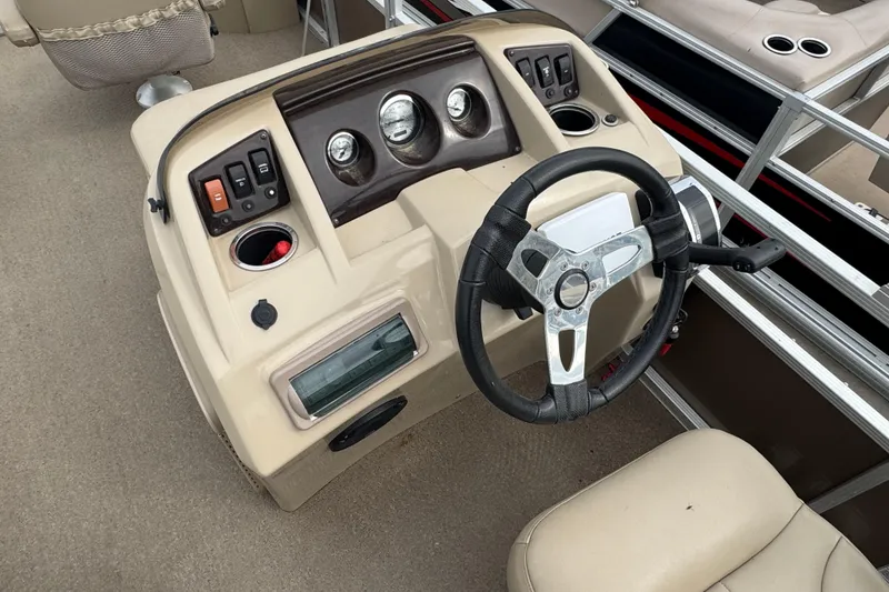 Slide: The Image of 2012 Bennington 24 SF boat seat with beige and white upholstery. - 11