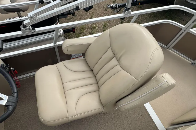 Slide: The Image of Beige seating and dark wood table on 2012 Bennington 24 SF boat interior. - 12