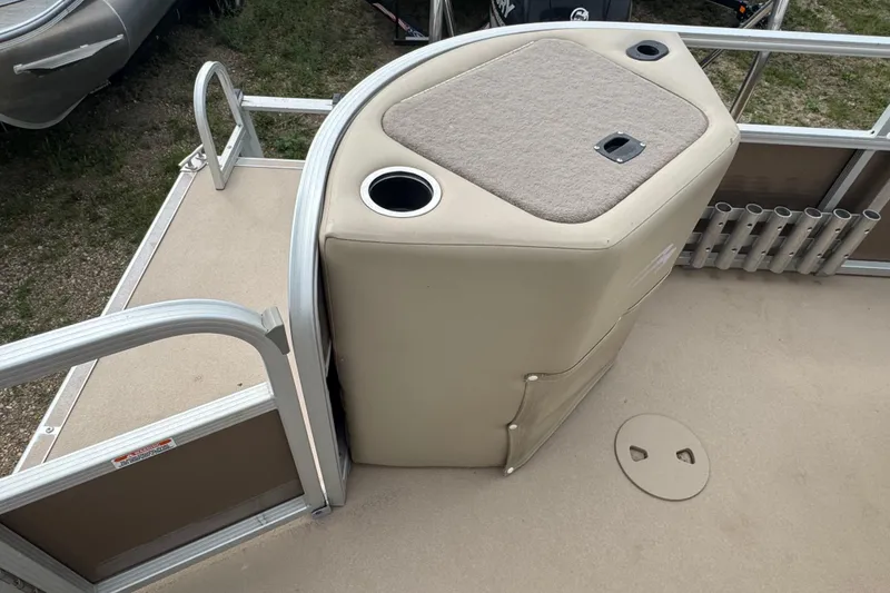 Slide: The Image of Beige captain's chair on 2012 Bennington 24 SF boat, featuring plush upholstery and armrest. - 13