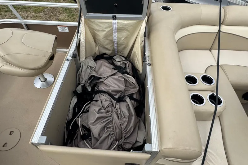 Slide: The Image of Safety and capacity labels on a 2012 Bennington 24 SF boat, warning against ladder use. - 15