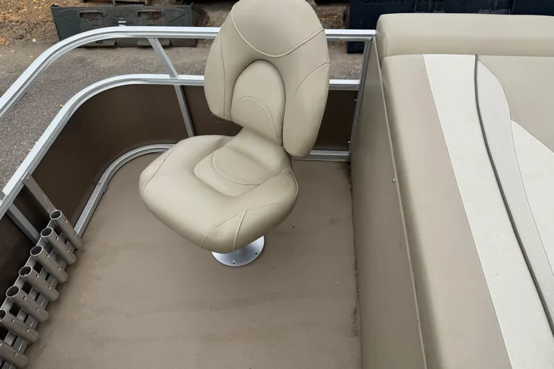 Slide: The Image of Beige seating area on a 2012 Bennington 24 SF boat, featuring rod holders. - 19