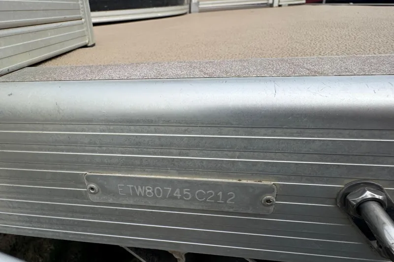 Slide: The Image of 2012 Bennington 24 SF pontoon boat with Mercury outboard motor on trailer. - 5