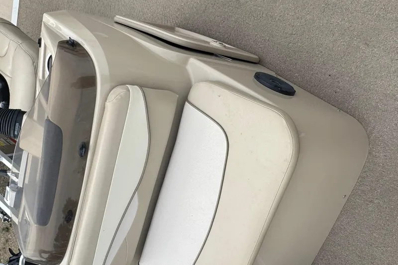 Slide: The Image of Beige captain's chair on 2012 Bennington 24 SF boat, with cup holder and railing. - 8