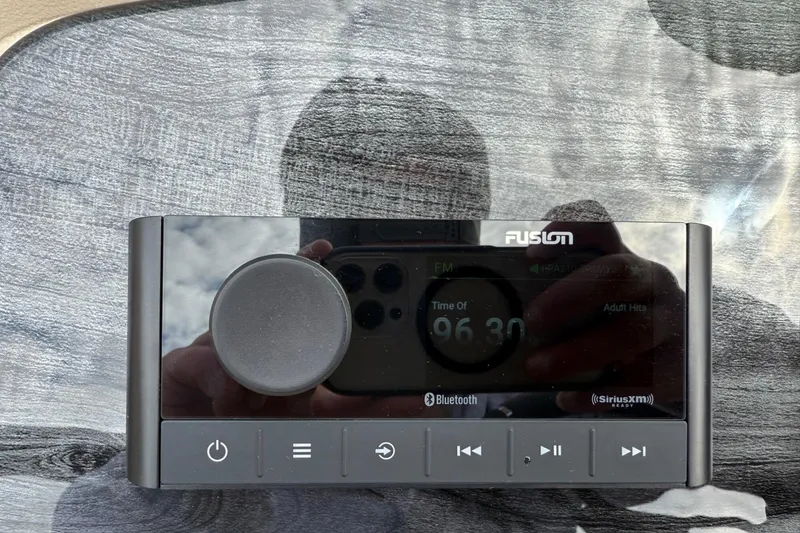 Slide: The Image of Digital radio display with Bluetooth and SiriusXM features, Tahoe 2185, 2025 model. - 14