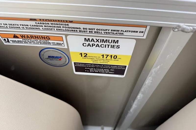 Slide: The Image of Warning labels and maximum capacity sign on 2025 Tahoe 2185 boat. - 20