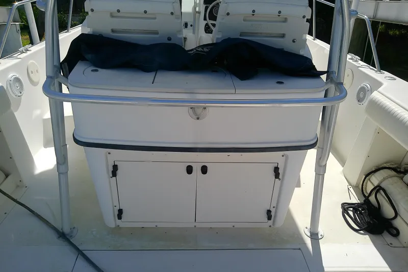 Slide: The Image of Dashboard gauges of a 2001 Boston Whaler 28 Outrage boat, showing speed and RPM. - 14