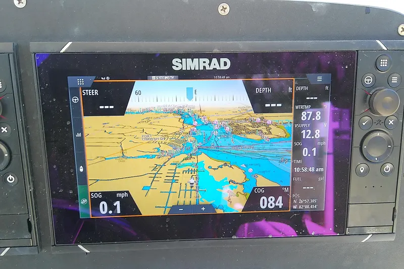 Slide: The Image of 2001 Boston Whaler 28 Outrage boat interior with open storage compartments. - 21